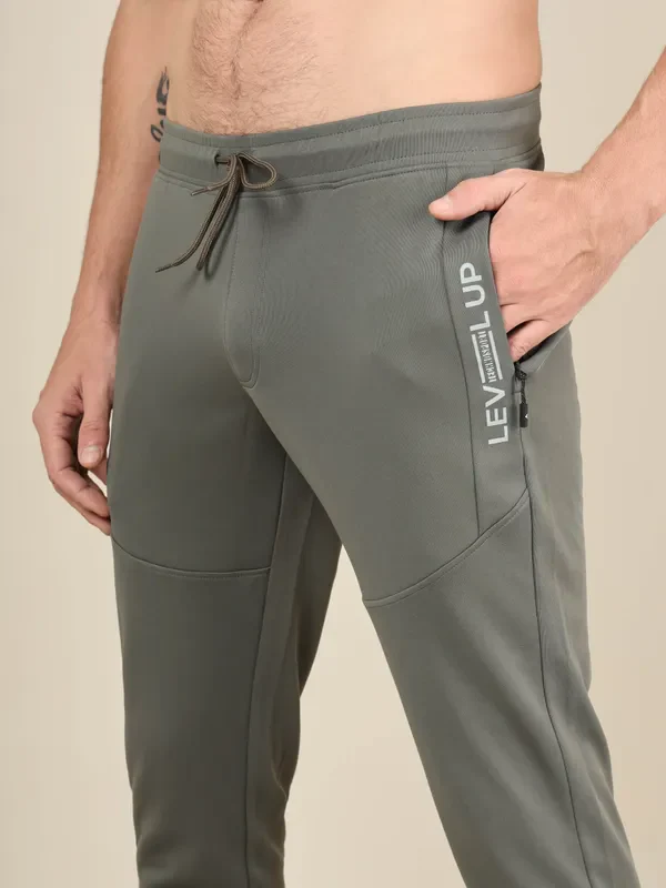 Men Solid Slim Fit Trackpants with TECHNO DRY - Image 6